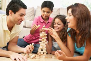 Family playing jenga