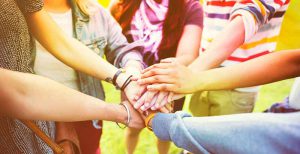 several hands together as a team